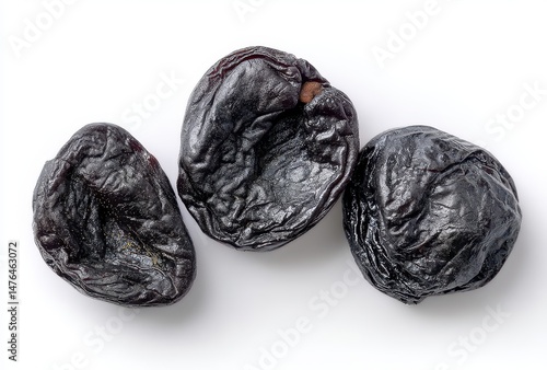 Wallpaper Mural Dried black fruits arranged on a white background showcasing their wrinkled texture and deep color, perfect for food, health, or culinary themes. Torontodigital.ca