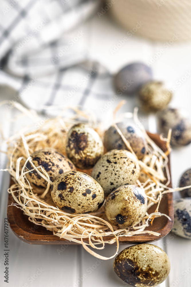 Spotted quail eggs on kitchen table.