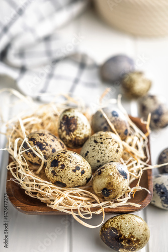 Spotted quail eggs on kitchen table.