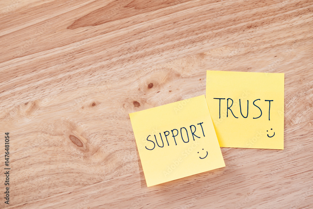 Support and trust in teamwork office space text notes professional setting top view team collaboration