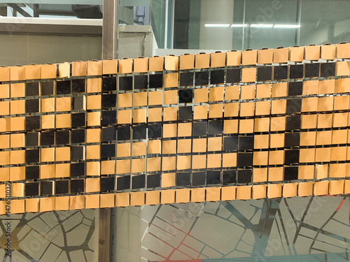 Modern Kinetic Wall Display with Reflective Tiles