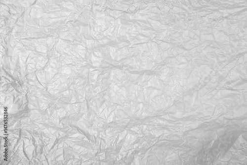 Plastikfolieweiss grau als zerknitterter Hintergrund