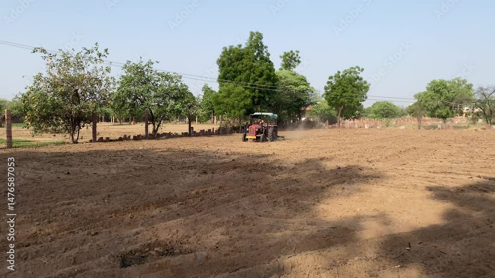 Cultivating Agriculture field, Cultivating soil in Indian Farm Land, Indian Agriculture System, Tractor, Farmer, Agriculture. Cultivating Agriculture field, Cultivating soil in Indian Farm Land, Indian Agriculture System, Tractor, Farmer, Agriculture.