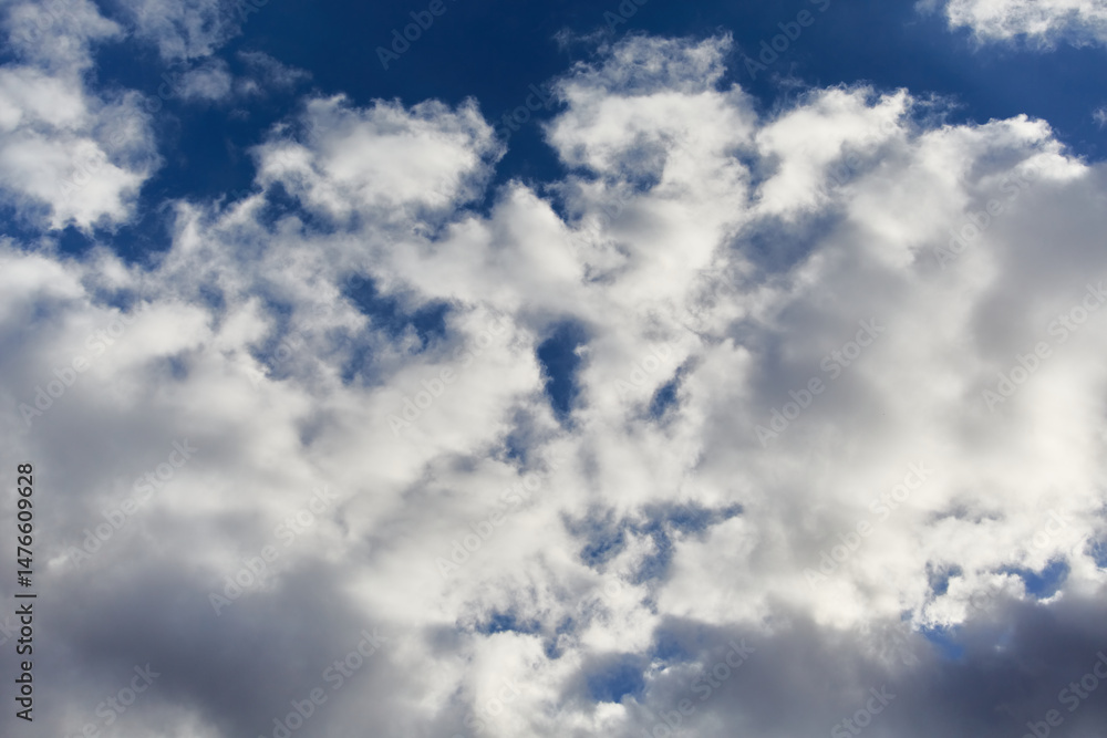 White cumulus clouds against the sky create a sense of infinite space and height. Used in themes of self-development, air travel, and ecology. White cumulus clouds against the sky create a sense of infinite space and height. Used in themes of self-development, air travel, and ecology.