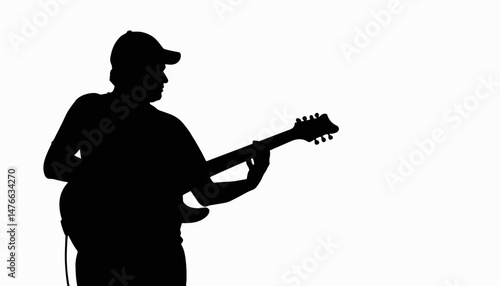 Musician playing guitar in silhouette, artistic expression