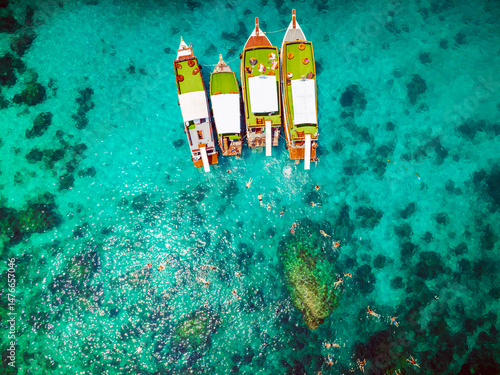 Top aerial view of  natural bay serving ton of traveler tourist  take bundle of tour boats dropped anchorage let people enjoy water sport together  in summertime Thailand travel and visiting