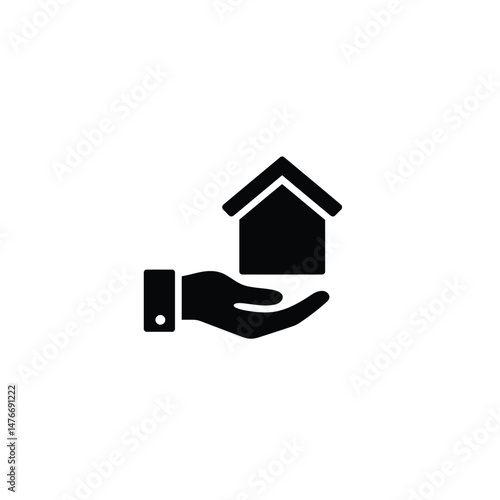 A hand holding a house icon representing real estate and home ownership