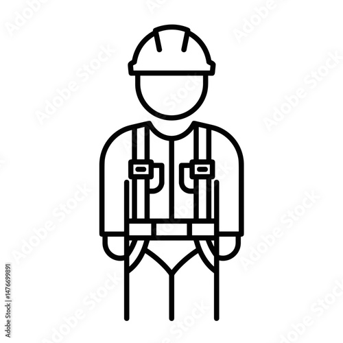 Construction worker in safety harness wearing a helmet  