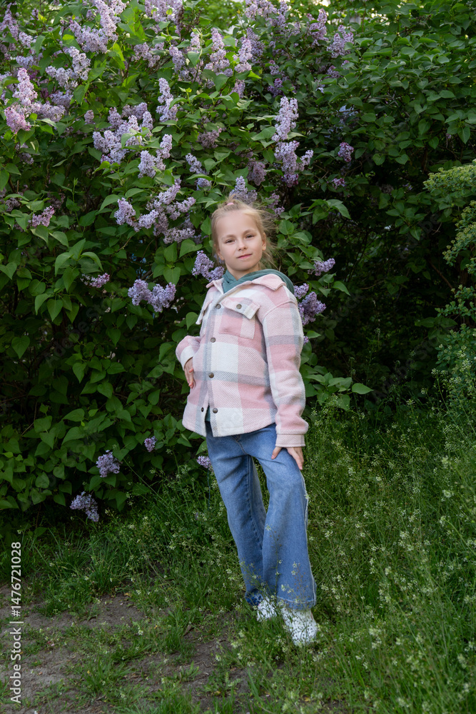 blonde girl posing in blooming lilac blonde girl posing in blooming lilac