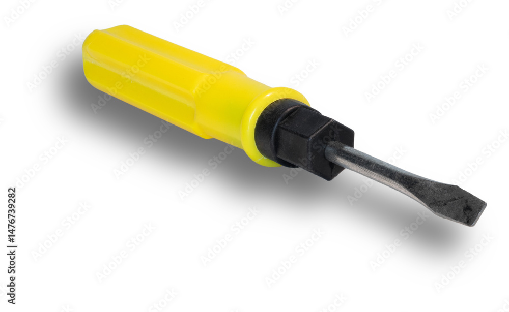 Shadow beneath a screwdriver with a flat head and bright yellow handle Shadow beneath a screwdriver with a flat head and bright yellow handle
