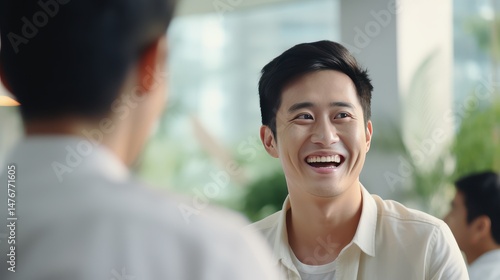Joyful Young Man in Bright Cafe Setting