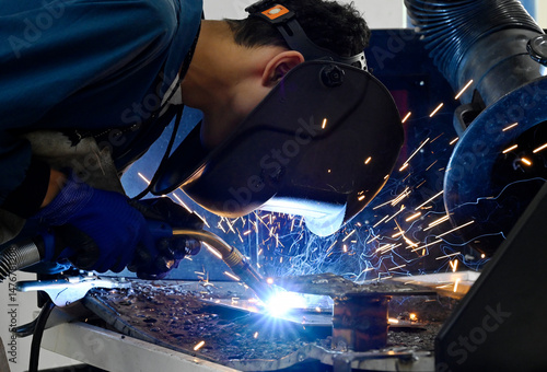 Wallpaper Mural joining metal parts together by welding Torontodigital.ca