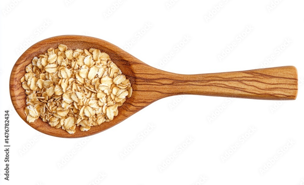 Rolled oats in a wooden spoon. A healthy, wholesome food ingredient, scattered in a light brown wooden spoon against a white background Rolled oats in a wooden spoon. A healthy, wholesome food ingredient, scattered in a light brown wooden spoon against a white background
