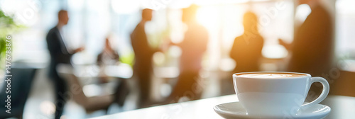 Networking over coffee in a corporate setting with a barista-style corner and executives engaging