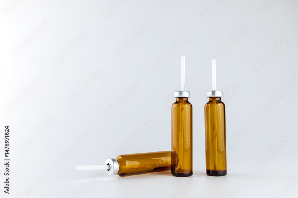 An empty bottle of oral liquid in a grey background An empty bottle of oral liquid in a grey background