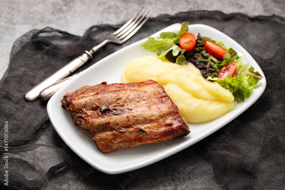 Braised ribs with potato puree and salad Braised ribs with potato puree and salad