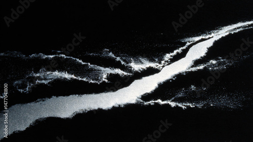 Fototapeta Naklejka Na Ścianę i Meble -  Silver spray paint gradient on black paper.