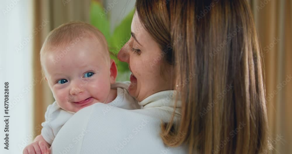 Close-up. Happy woman kisses a newborn baby. Young mother holding her little son. Beautiful Happy Family. Maternity concept. Close-up. Happy woman kisses a newborn baby. Young mother holding her little son. Beautiful Happy Family. Maternity concept.