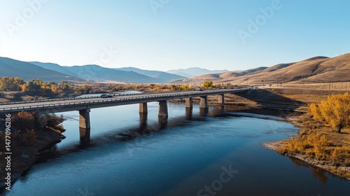 Wallpaper Mural A scenic expressway bridge spanning over a river, with clear skies above and vehicles moving across, symbolizing connectivity and long-distance travel Torontodigital.ca