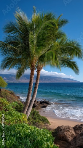 Tropical Palm Trees Swaying on Sandy Shoreline Overlooking Ocean Waters and Distant Mountains Under Clear Blue Skies in Paradise