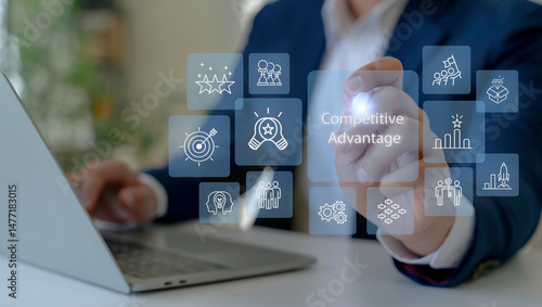 Competitive Advantage Concept. The key to business success. Working on laptop, competitive advantage with the icons of innovation, differentiation strategy, value creation, performance and achievement photo
