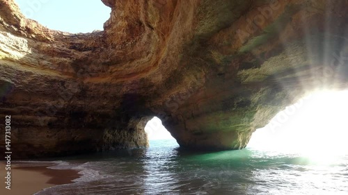 Stunning Natural Sea Cave with Golden Arch and Turquoise Waters at Benagil Algarve