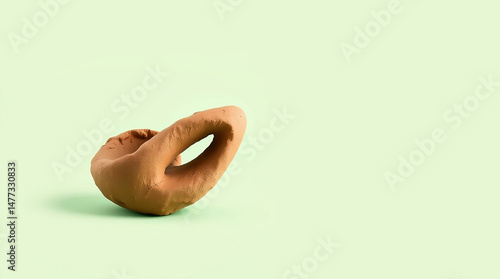 Abstract Clay Sculpture on Light Green Minimalist Background