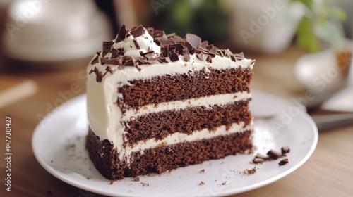 Wallpaper Mural A slice of chocolate cake with white frosting and chocolate shavings on a white plate. Torontodigital.ca