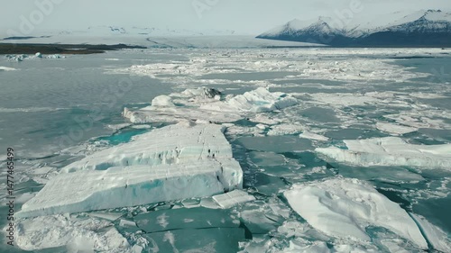 Jökulsárlón Glacier Lagoon, Iceland - Cinematic Drone Orbit of Endless Floating Icebergs - Dramatic Ice Formations on Deep Blue Water - Vatnajökull National Park, Vatnajökulsþjóðgarður