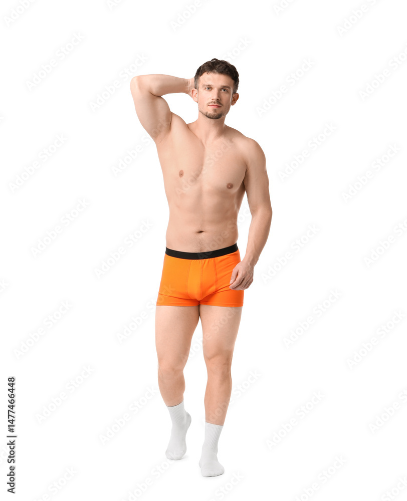 Young man in stylish orange underwear on white background Young man in stylish orange underwear on white background