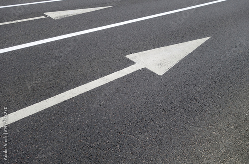 Wallpaper Mural Traffic painted white arrows and lines on asphalt road. Torontodigital.ca