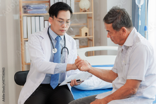 Elderly man seeks medical advice for wrist pain after strenuous work, consulting a specialist to discuss symptoms and possible treatment.