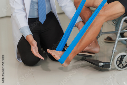 A patient with lower limb weakness participates in a rehabilitation session, receiving attentive guidance from a healthcare professional to regain strength and mobility.
