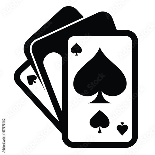 Black spades suit dominates the forefront of three playing cards in image