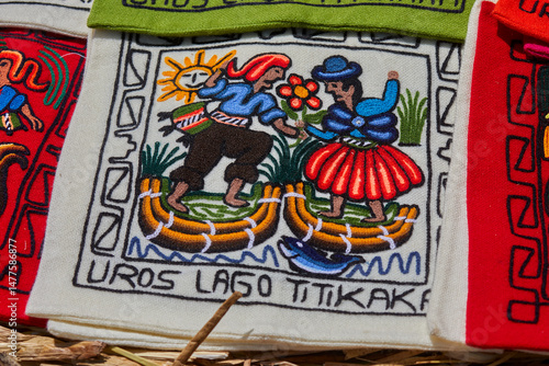 Traditional embroidery created by Uros artisans on the floating islands of Lake Titicaca, Puno, Peru. Rich in vibrant colors and symbolic motifs.