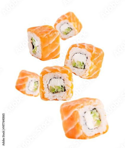 Levitation or flying of sliced homemade organic sushi rolls or maki made from fresh raw salmon fish, boiled rice, philadelphia cream cheese and avocado or cucumber slices isolated on white background