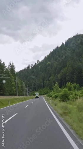 Vertical view of Austria road from car