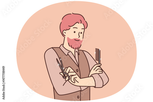 Man hairdresser from beauty salon stands with arms crossed holding comb and scissors