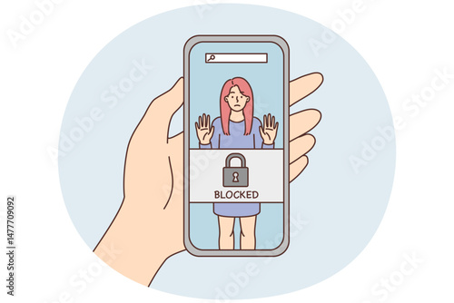 Phone in hand with photo of woman and inscription blocked due to unacceptable behavior