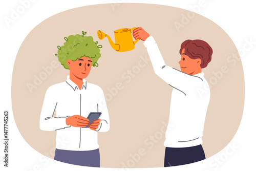 Man manager takes care of employees, uses watering can as metaphor for investing in company personnel. Caring boss develops next generation of company employees for future success.