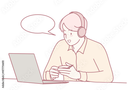 A young individual wearing headphones is deeply engaged and focused on a laptop during an online conversation