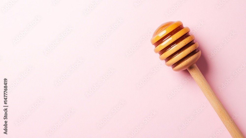 Honey dipper on a pink background (1) Honey dipper on a pink background (1)
