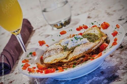 Canvas Print heuvos rancheros with pork verde, fried eggs, and fresh salsa