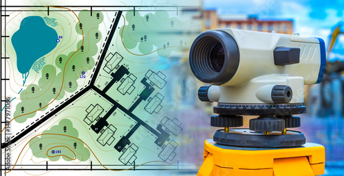 Surveying instrument with residential site development map showing buildings, roads, and topography for land planning. – Land Surveying, Real Estate Development, Construction.