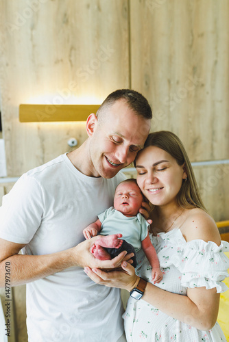 Obraz na płótnie New parents joyfully celebrate the arrival of their newborn in a bright hospital rooma heartwarming moment filled with love, cherished forever, creating lasting memories that strengthen their bond w salonie