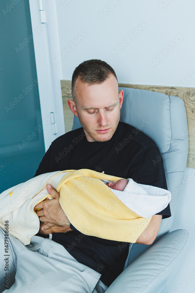 A Proud Father Cuddling His Newborn Baby in a Cozy Nursery Setting, showcasing the deep bond formed through adoration and affection during precious moments of early parenting and family life