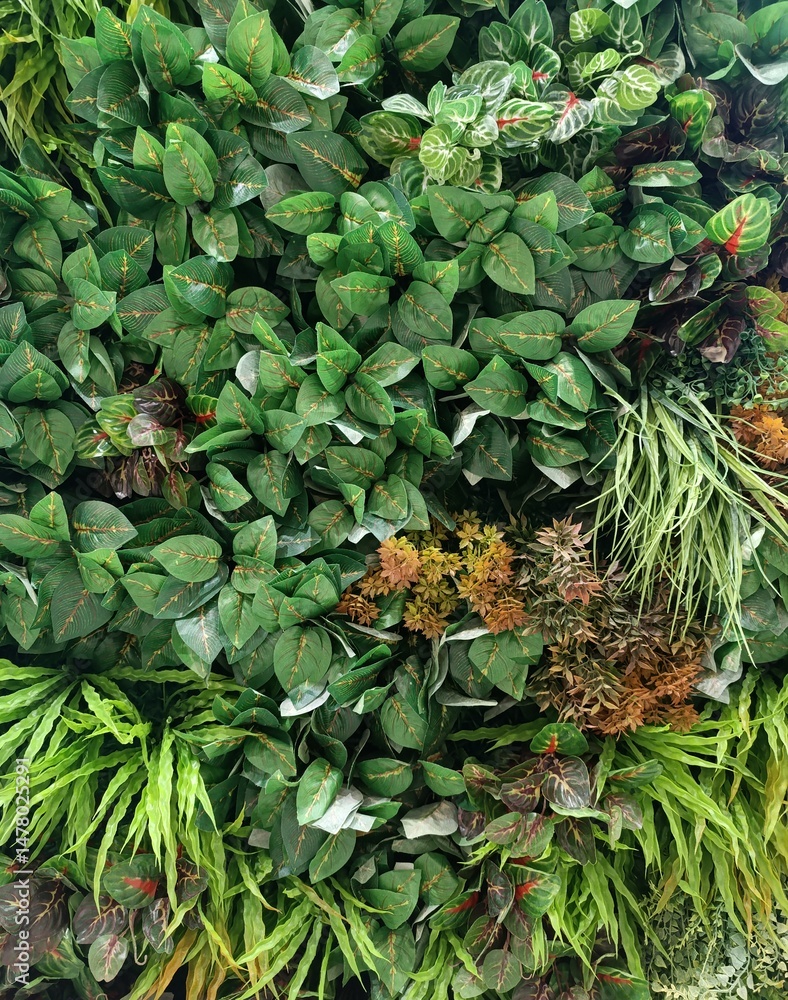 Obraz premium wall of artificial plants, panel of plants, indoor landscaping,plant green background, close up of plant 