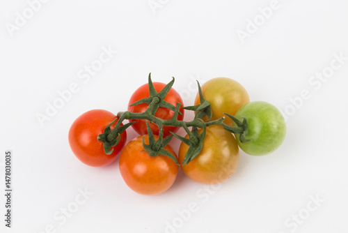 Yellow, Red, and Green Tomatoes on White Background