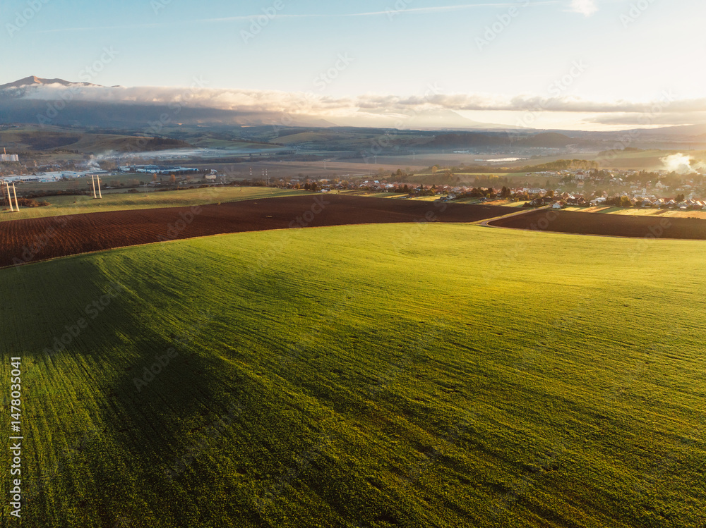Sunset over Liptov region with and High Tatras mountains around. Liptovsky Mikulas landscape, slovakia.