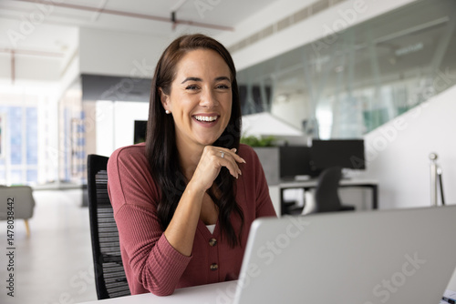 Wallpaper Mural Successful and optimistic. Workplace portrait beautiful smiling young woman office worker accountant enjoying career sitting at desk looking at camera with candid smile distracted from using notebook Torontodigital.ca
